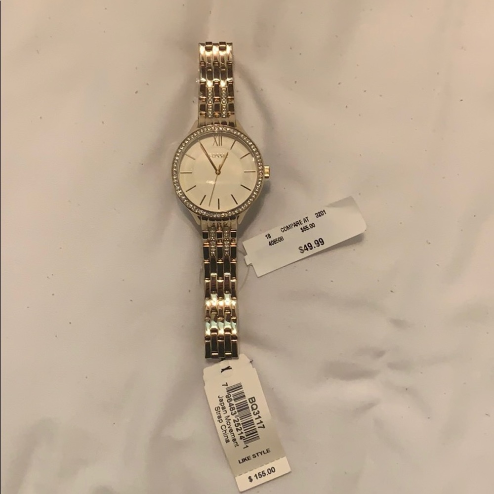 Gold fossil watch